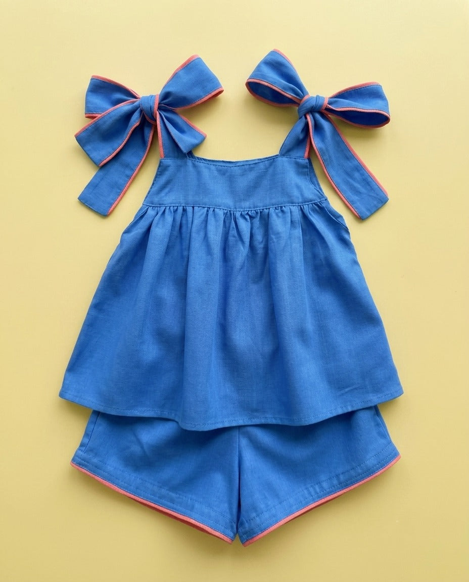 Conjunto azul com laços - foto 1